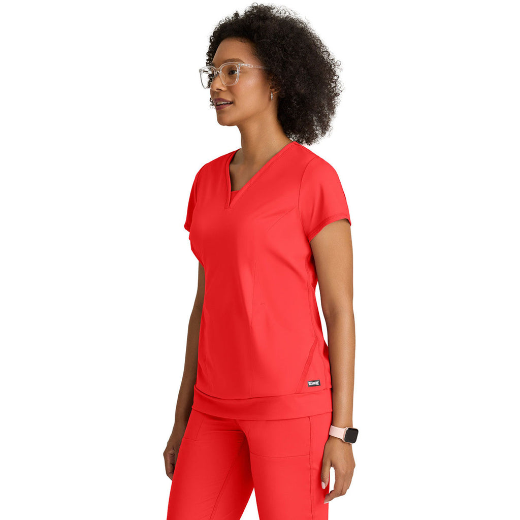 Grey's Anatomy Women's Radiant Coral Two Pocket V-Neck Motivate Top